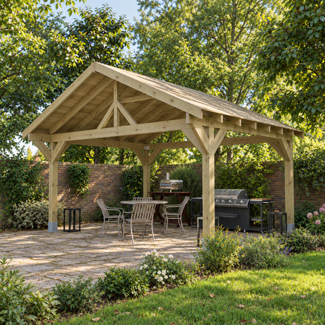 A large wooden garden gazebo with a pitched roof and open sides, shown installed on a stone patio in a landscaped back garden with trees, lawn, patio furniture, and a grill.