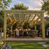 A wooden pergola with a clear corrugated roof over a dining table and chairs in a landscaped backyard, with string lights, a grill, and greenery at dusk.